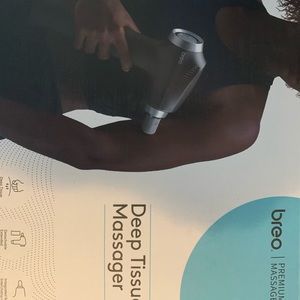 New in box Breo Massage Gun, Deep Tissue Percussion Muscle Massager